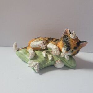 Hand-Painted Calico Cat Figurine Lounging On Green Pillow
